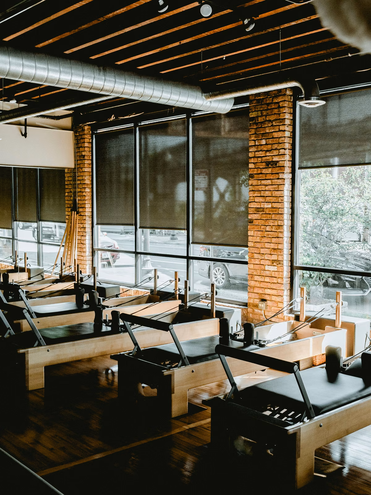 Licensed stock: empty boutique Pilates studio with reformers — illustrative fitness-studio atmosphere, no logos.