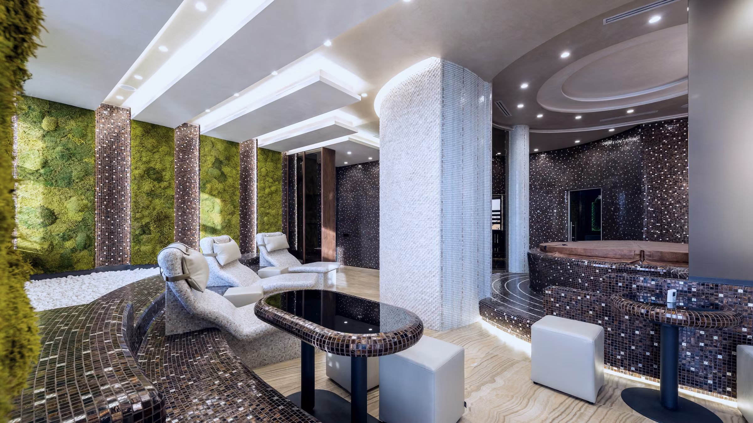 Empty spa lounge with depth and multiple seating zones; illustrative directory browse mood, no logos.